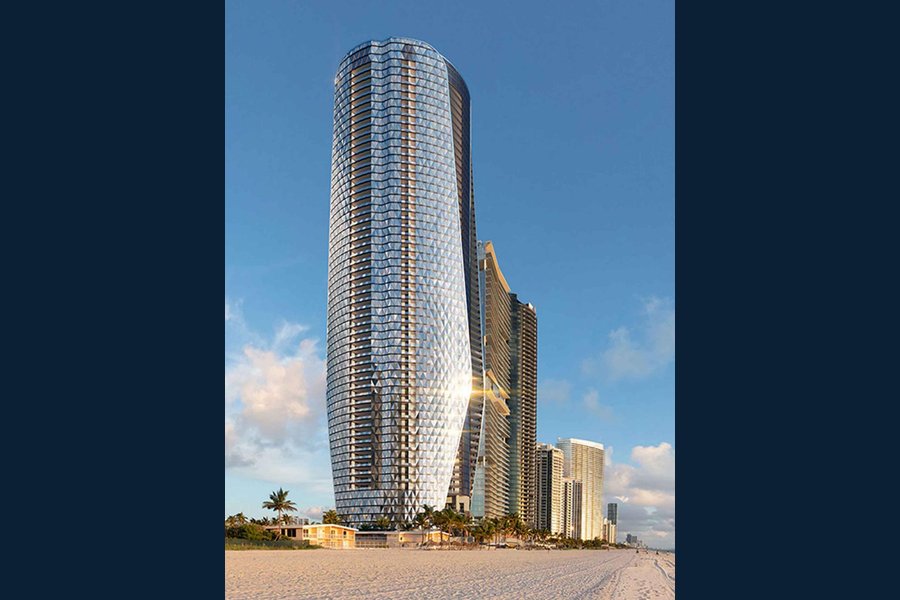 Rendering of the curved glass Bentley Residences tower on the beach in Sunny Isles