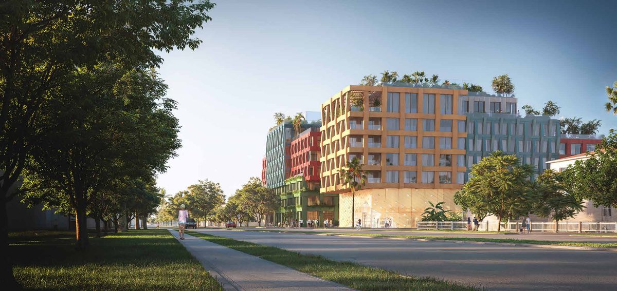 Rendu de WOMA depuis la rue : un immeuble de hauteur moyenne aux volumes colorés à motifs, avec des arbres sur le toit